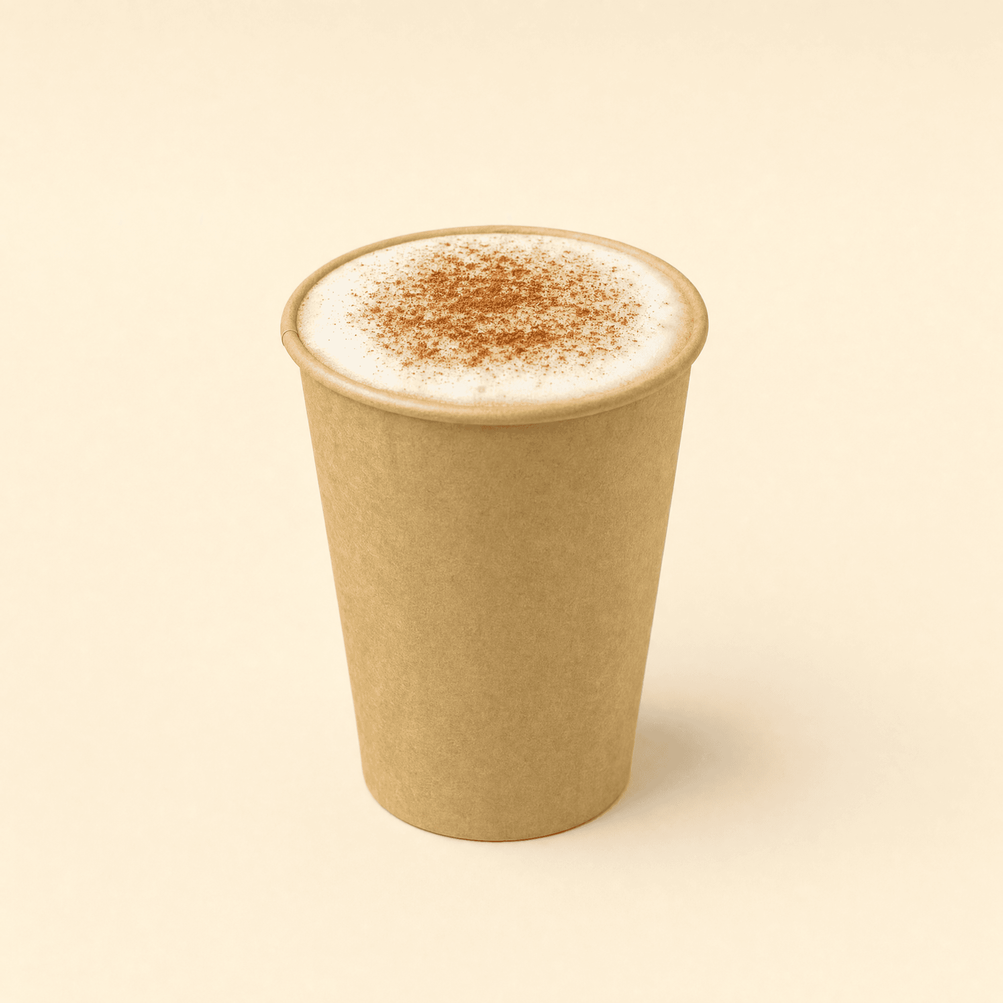 Kraft hot cup filled with a cappuccino topped with milk foam and a dusting of cinnamon on a cream background