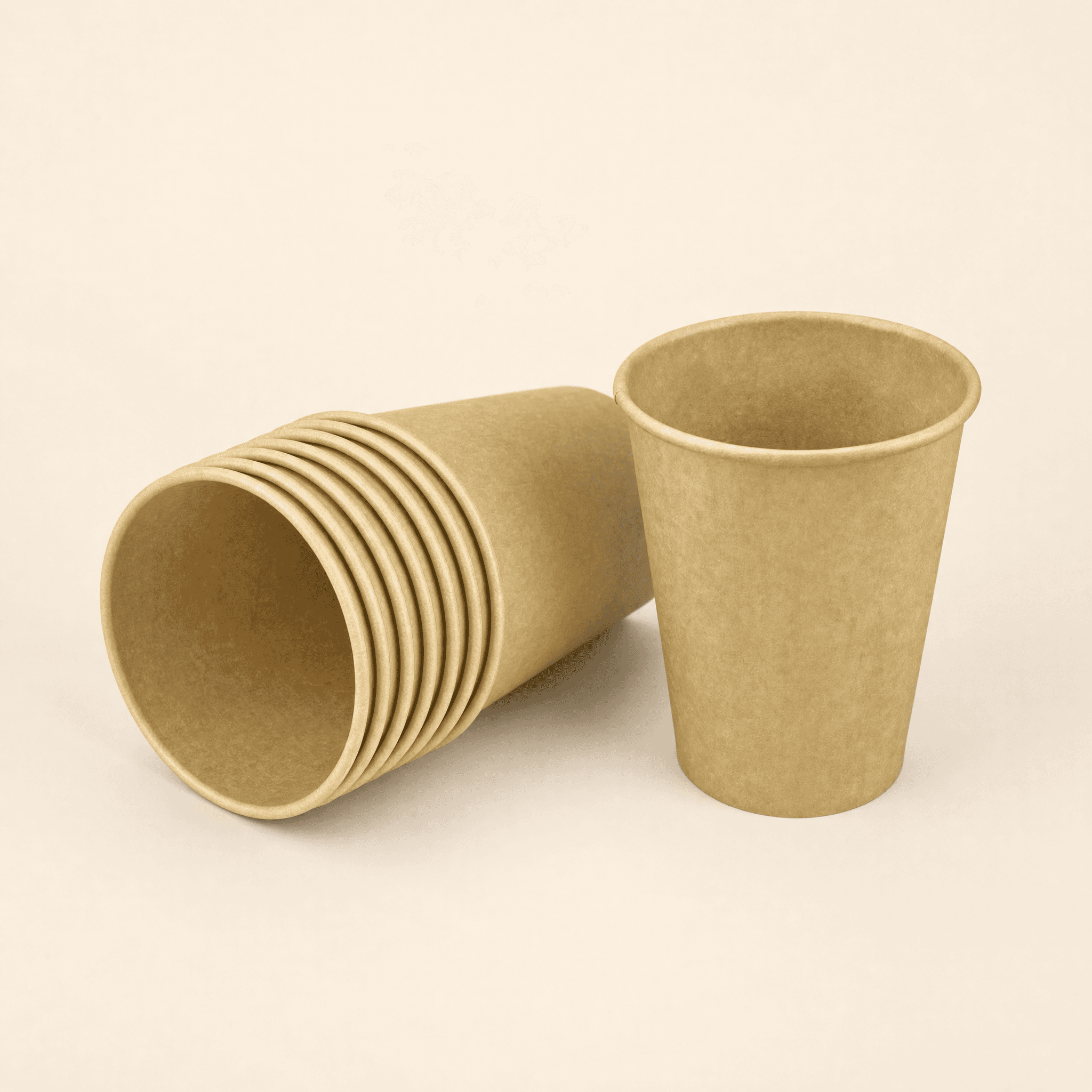 Several empty kraft hot cups nested into a stack with one upright cup beside them, showing they are sold in bulk by the case