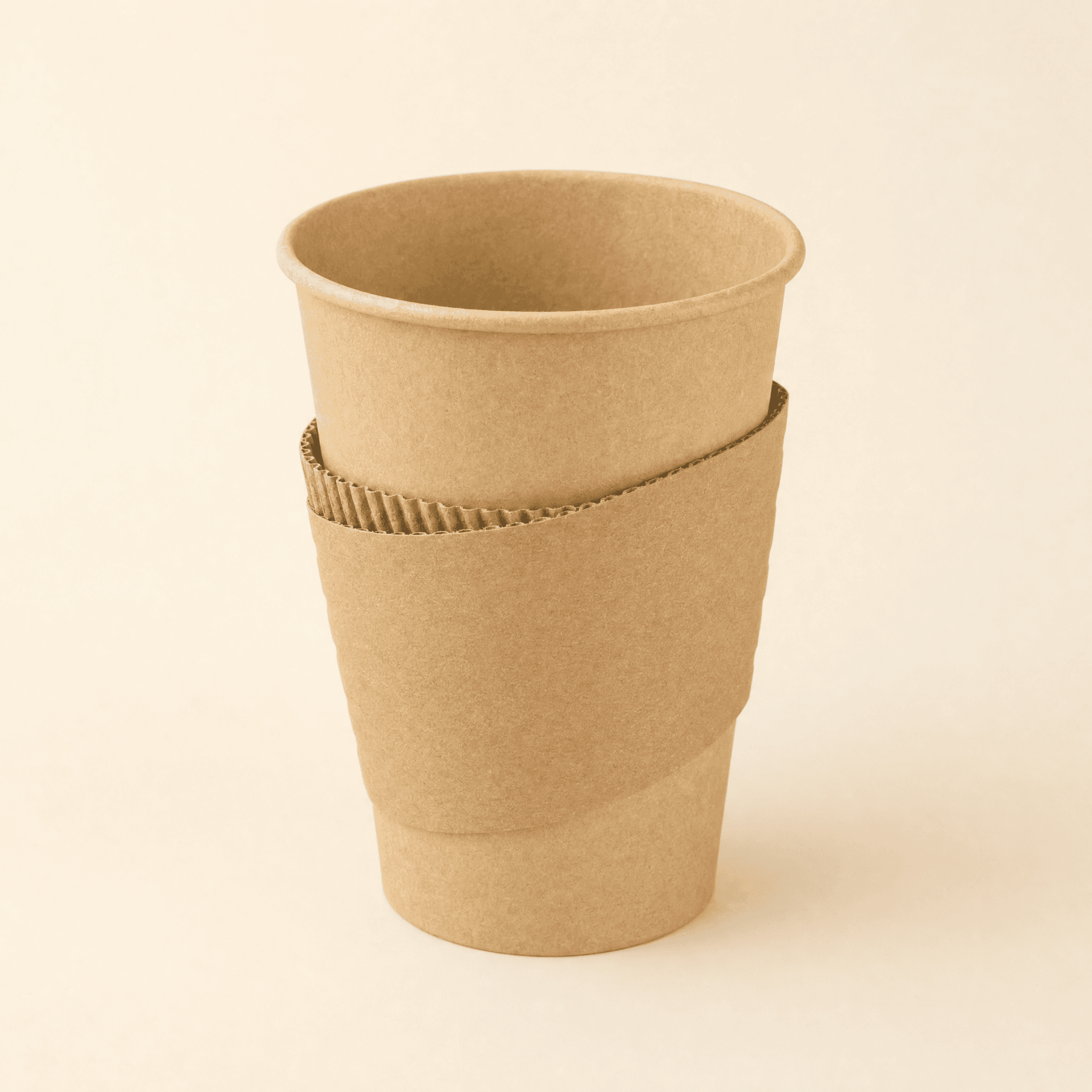 Kraft hot cup wearing a corrugated kraft sleeve around its middle on a cream background