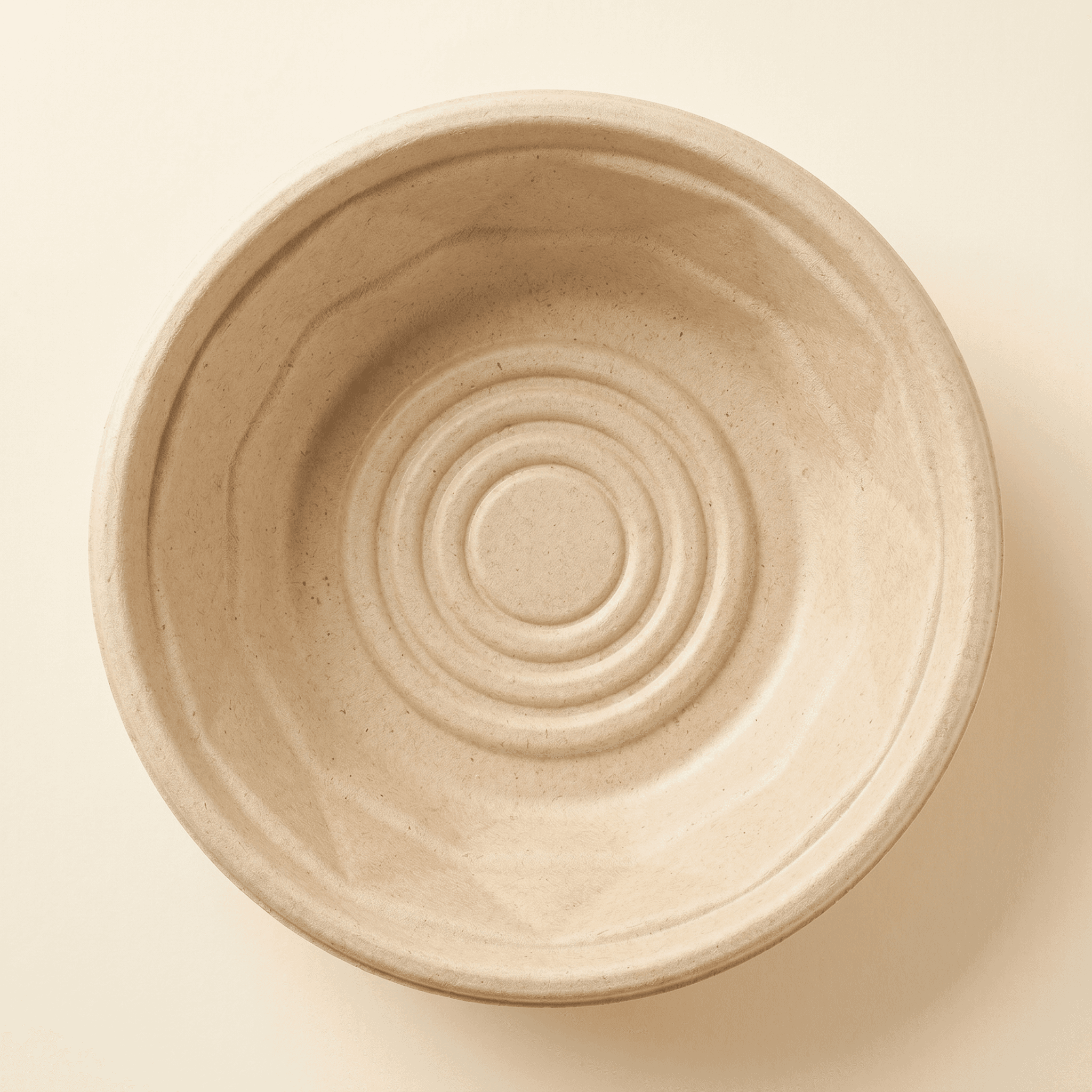 Top-down view into the empty bowl showing the embossed concentric base pattern and the faceted sidewall