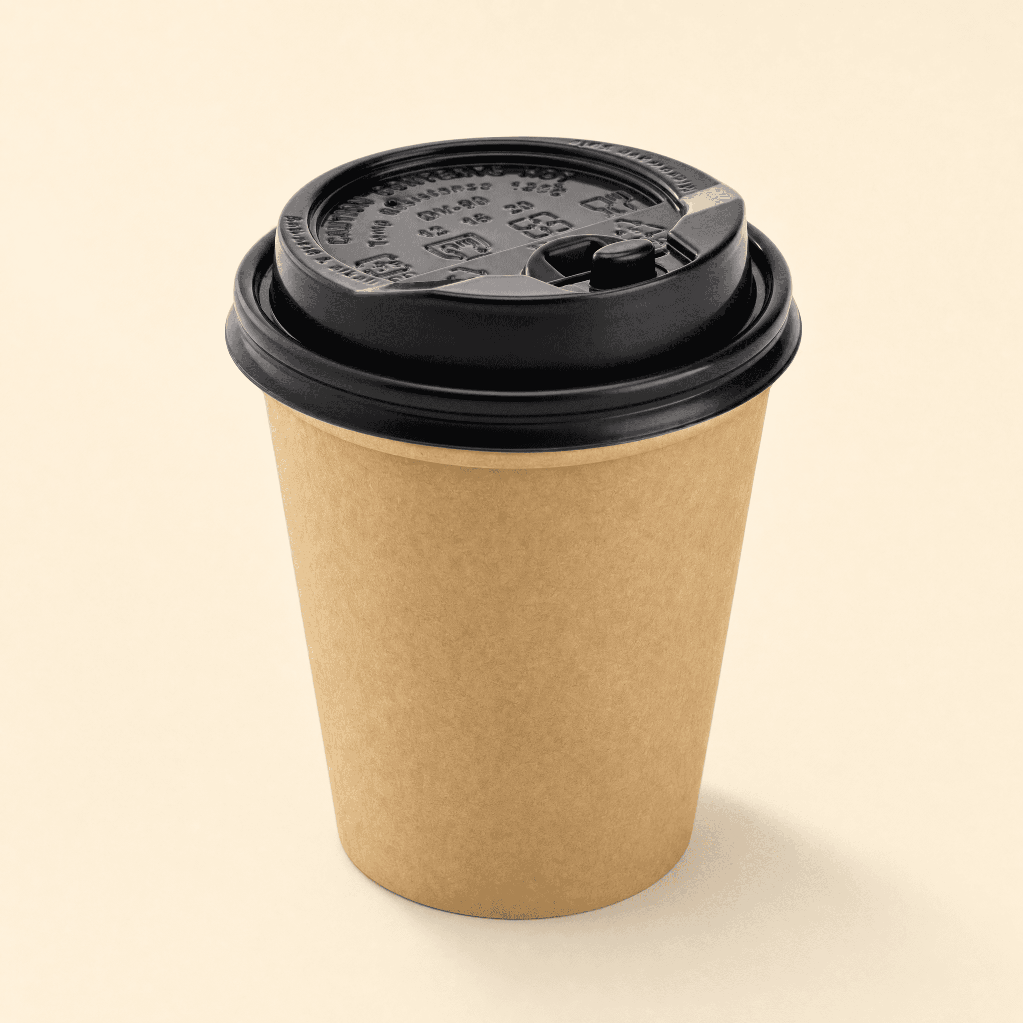 Black dome sip-lid snapped onto a kraft brown paper hot cup on a cream background