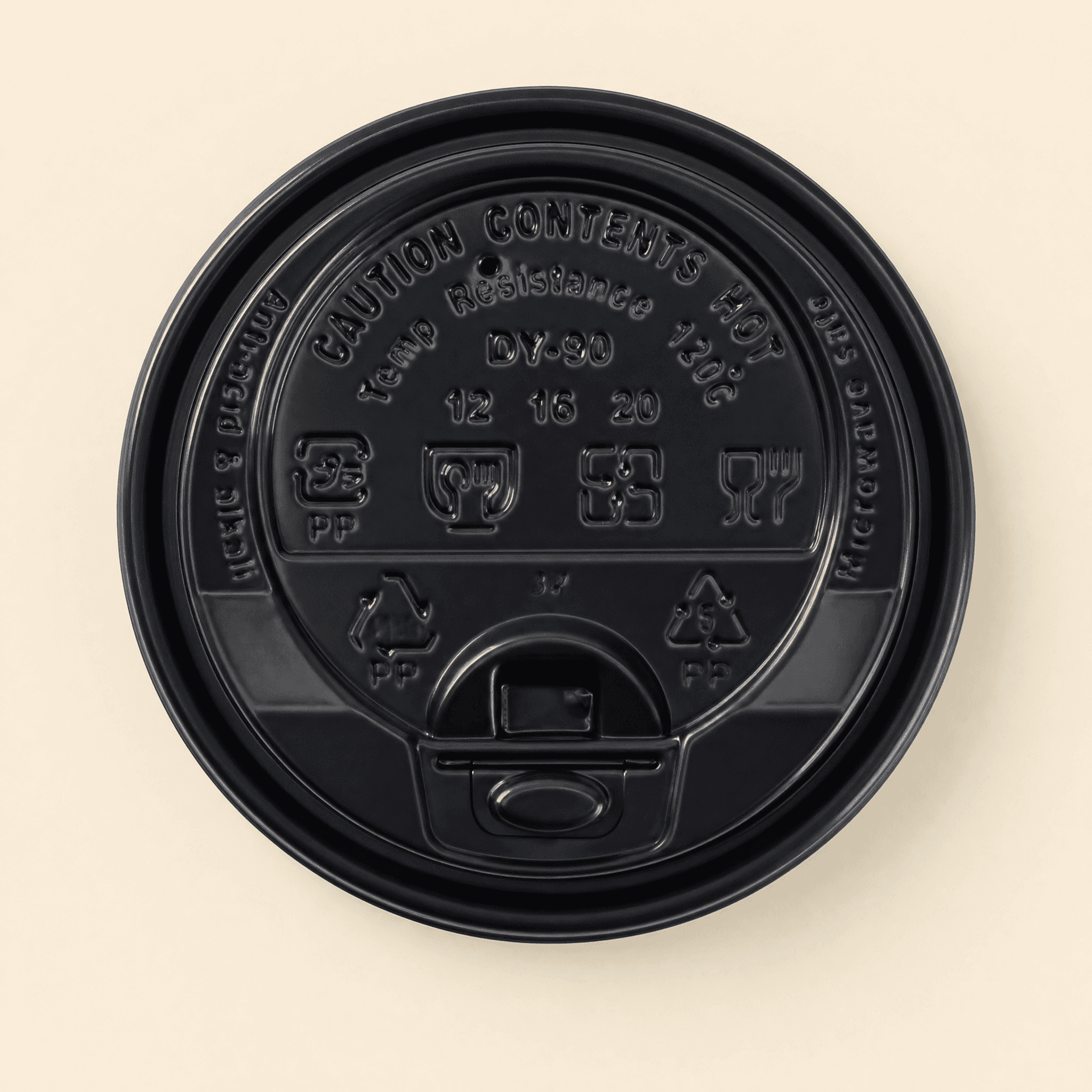 Top-down view of the black coffee cup lid showing the embossed CAUTION CONTENTS HOT text, recycling marks, and the re-closeable sip tab