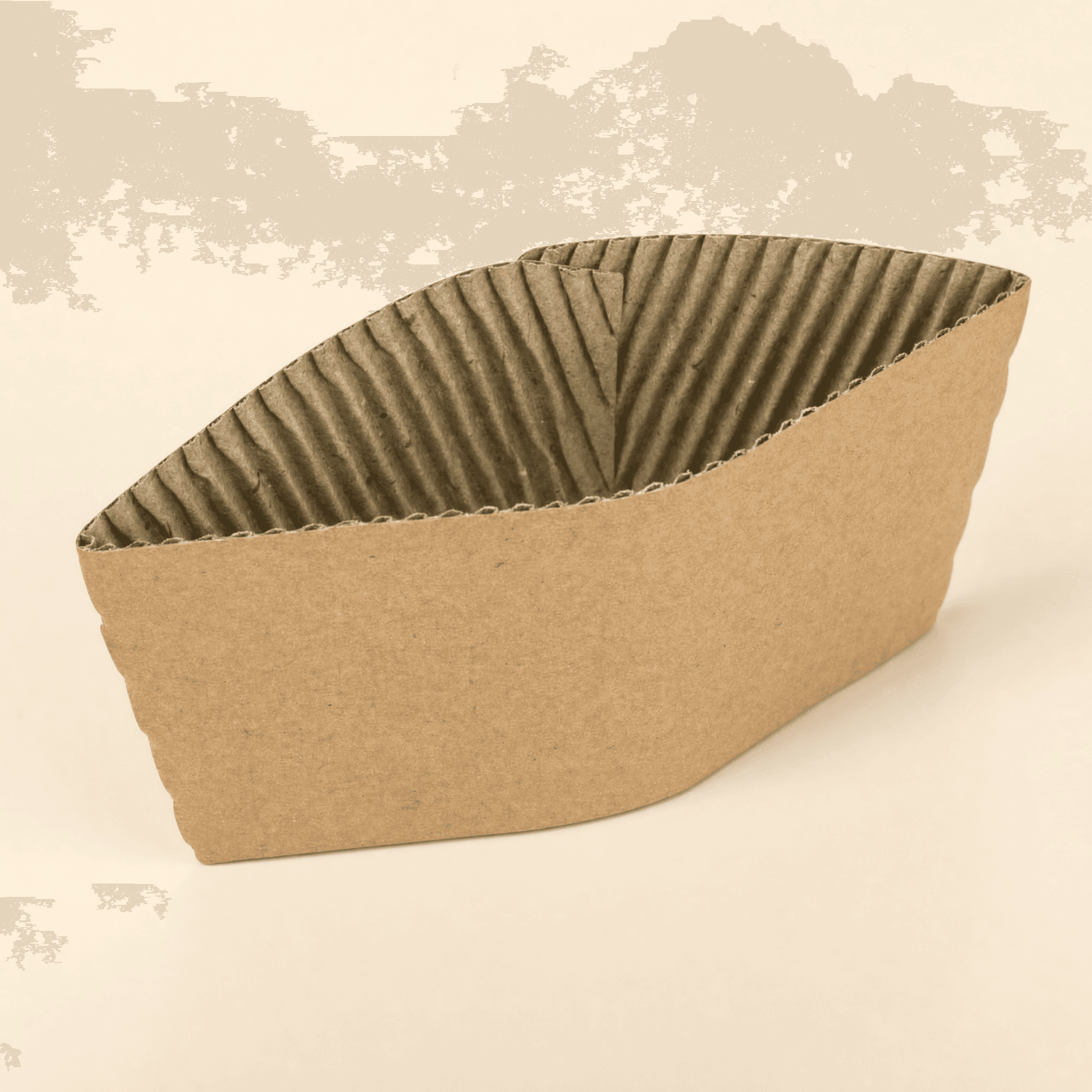 Corrugated kraft coffee cup sleeve at a three-quarter angle on a cream studio background, showing the smooth kraft outer band and fluted corrugated inner ridges