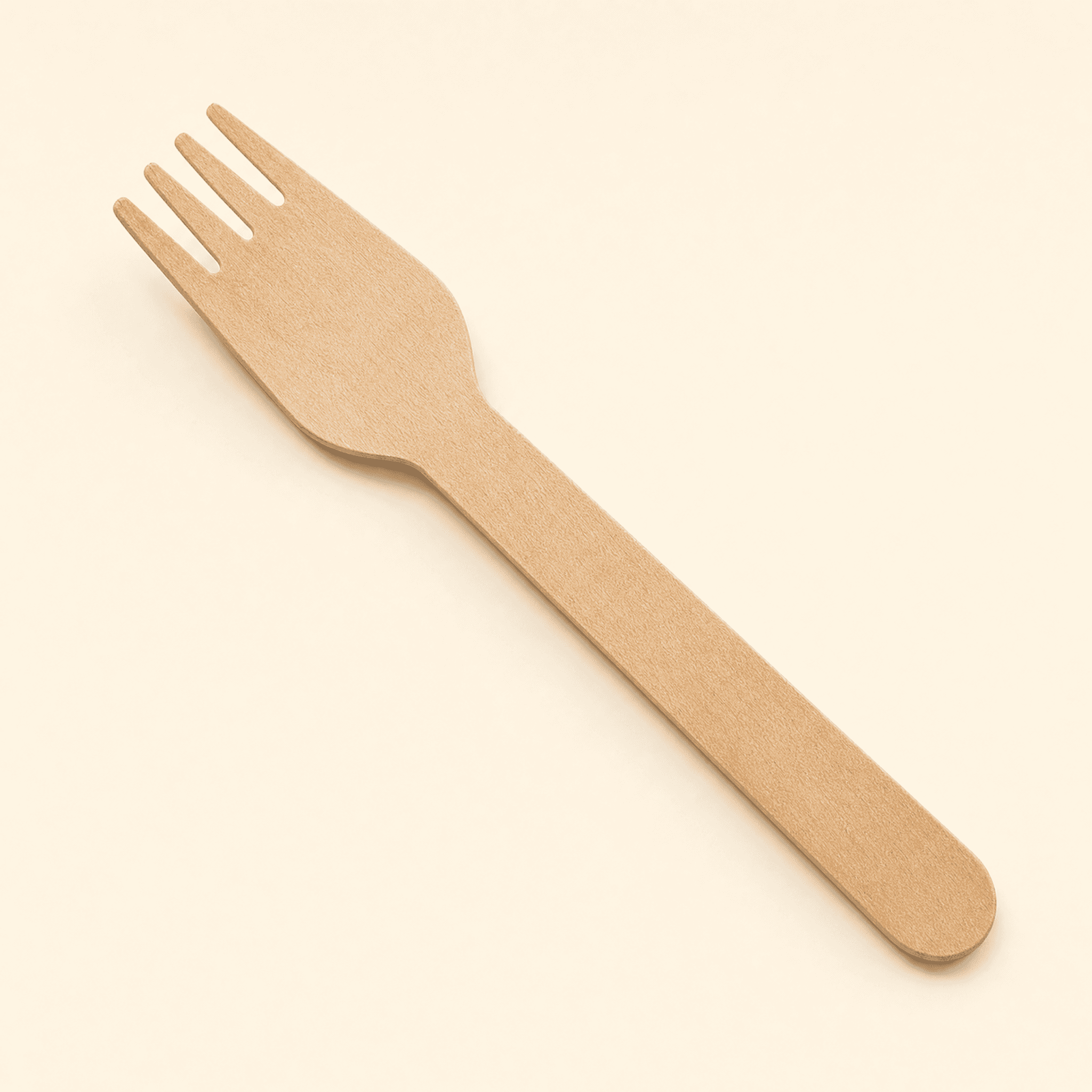 Single birch wood fork at a three-quarter angle on a cream studio background, showing the four tines, faceted shoulder and flat tapered handle