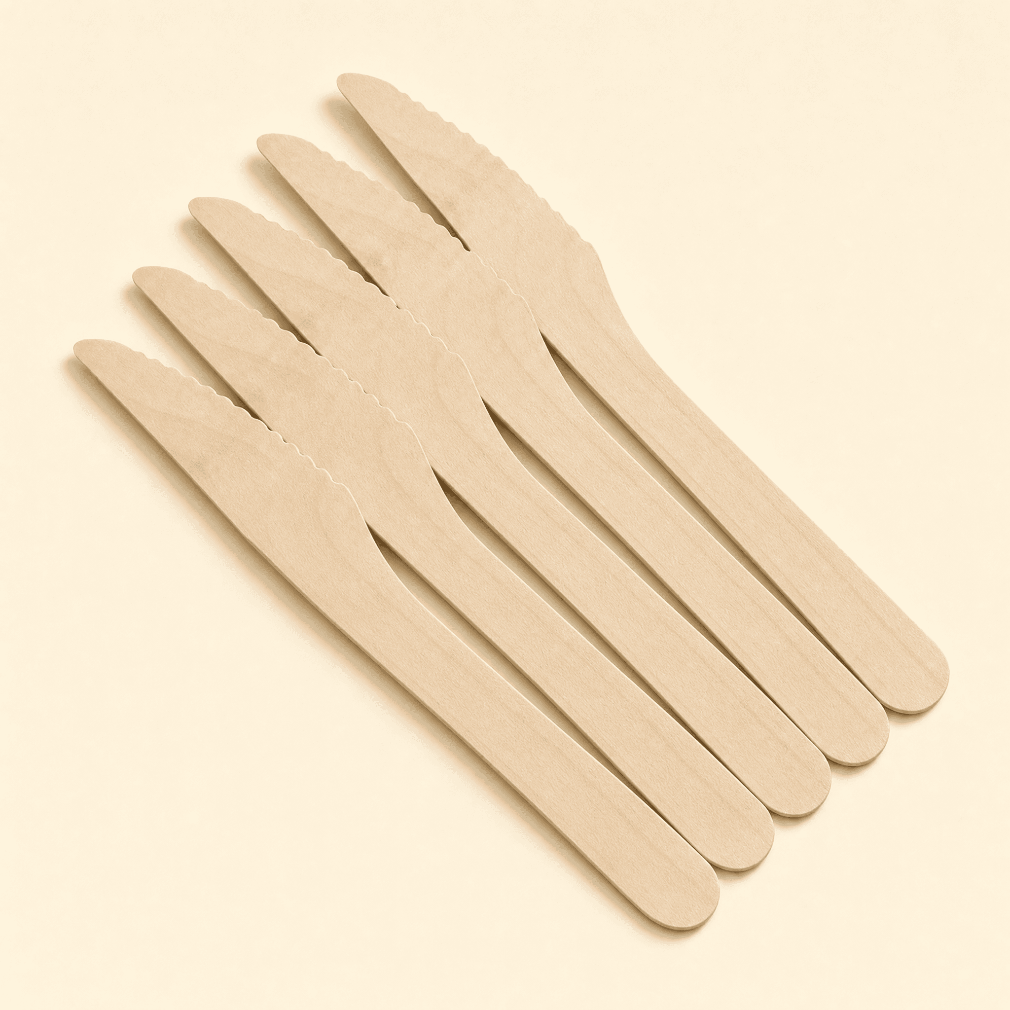 Several identical birch knives fanned out in a row, showing they are sold in bulk by the case