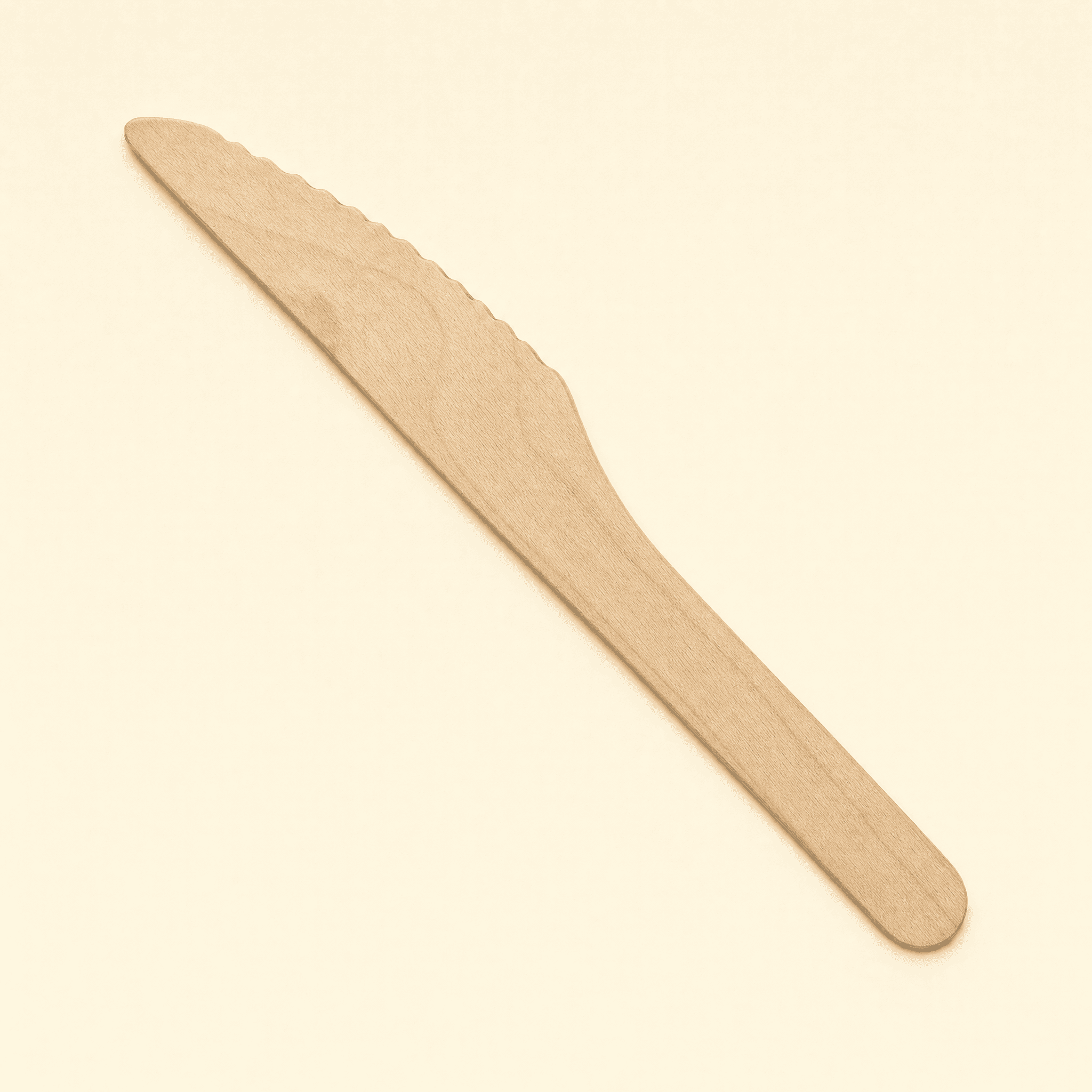 Top-down view of the birch knife on a cream background, showing the serrated blade and tapered handle